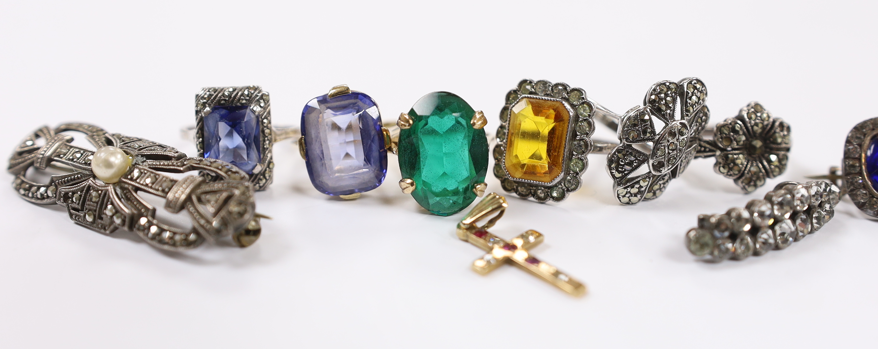 A 9ct and single stone rectangular cushion cut synthetic sapphire set ring, a 9ct gold and gem set cross pendant and a small group of early to mid 20th century jewellery including marcasite and paste set.